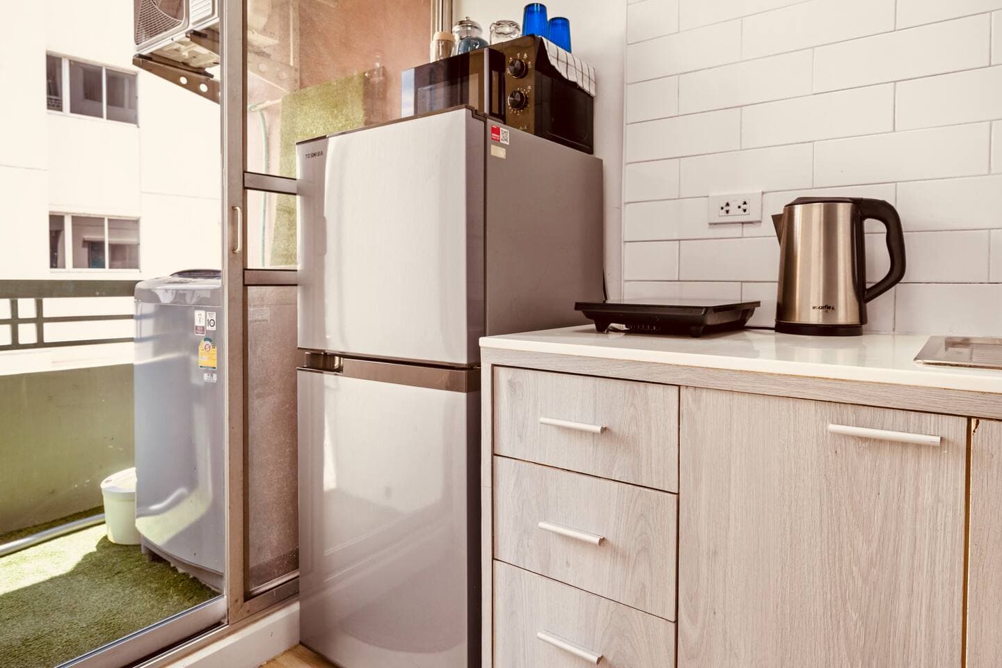 Fully equipped kitchen featuring a large refrigerator and freezer