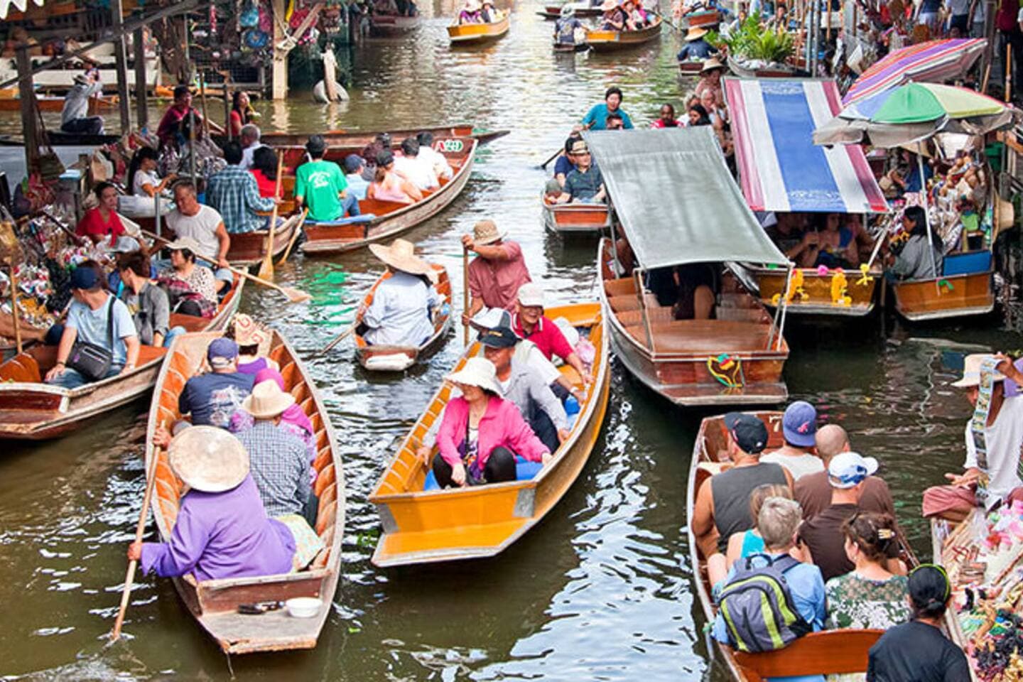 Traditional colorful boats at a famous Bangkok floating market
