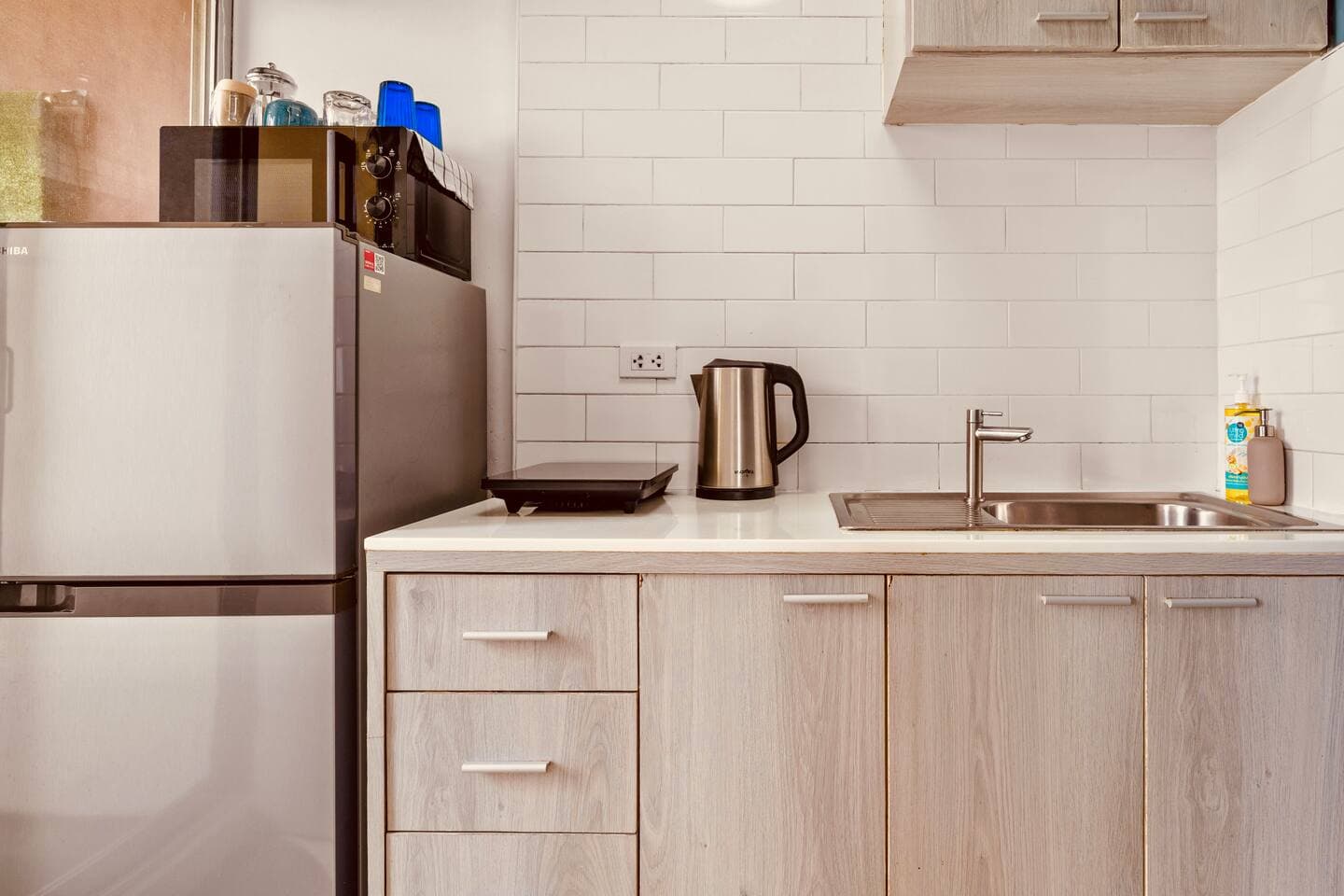 Electric stove, kettle, and kitchen essentials for home cooking