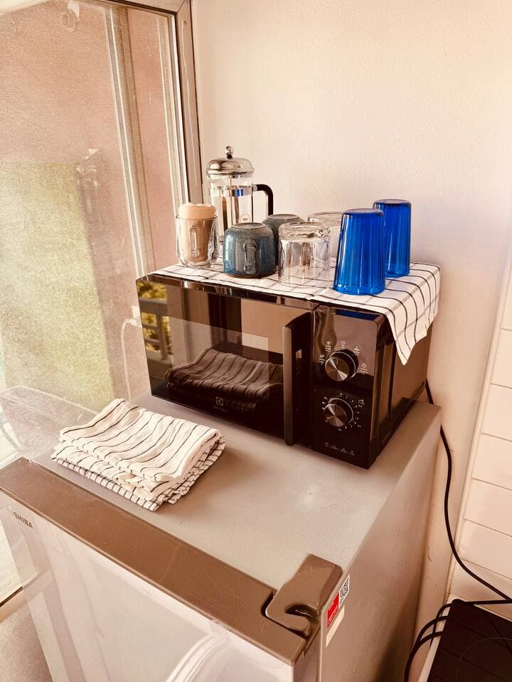 Well-organized kitchen counter with coffee maker and supplies