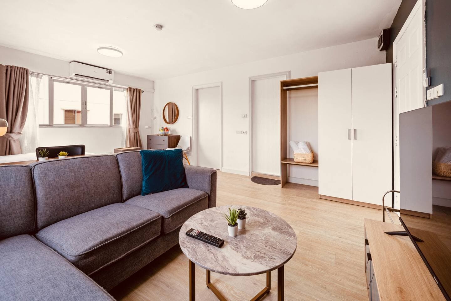 Living area featuring built-in wardrobe and functional storage