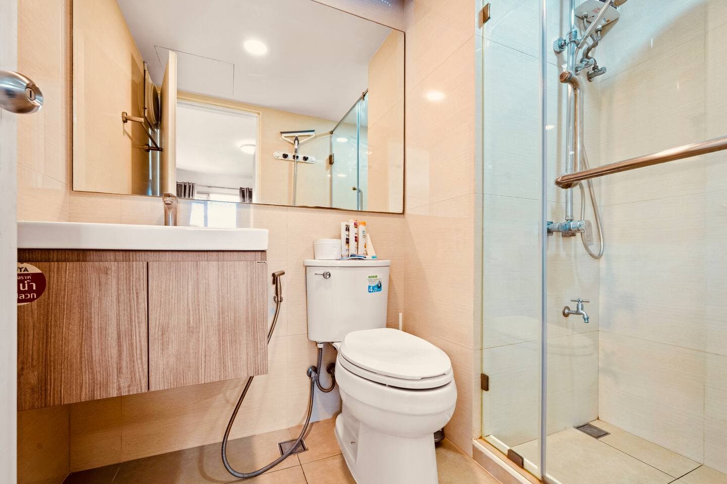 Clean, modern bathroom with western-style toilet and vanity