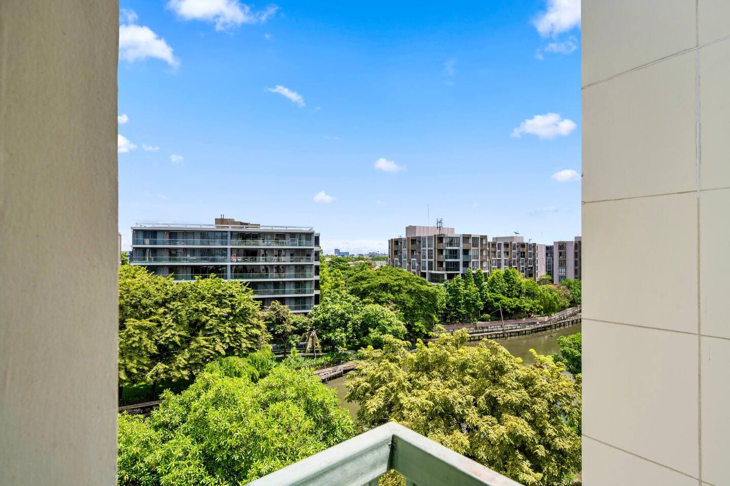 Lush garden and river views from the Building D 7th-floor balcony