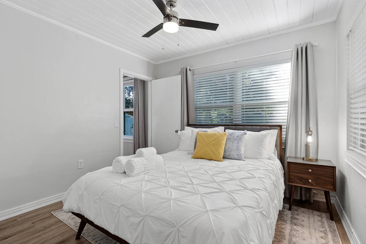 Close-up of comfortable bedding and designer pillows – The Falling Moss Villa