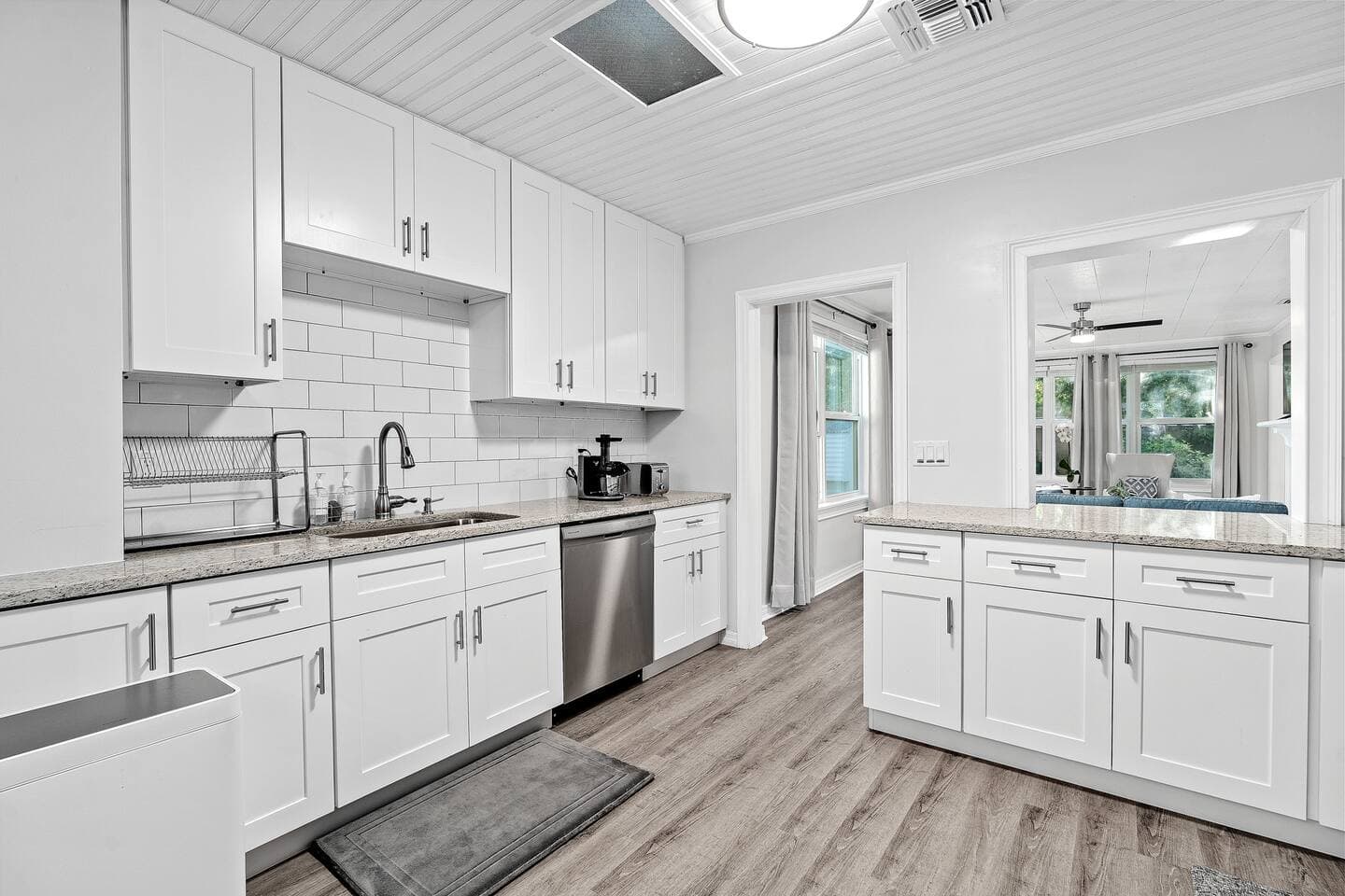 Full view of the chef’s kitchen with quartz countertops – Falling Moss Villa