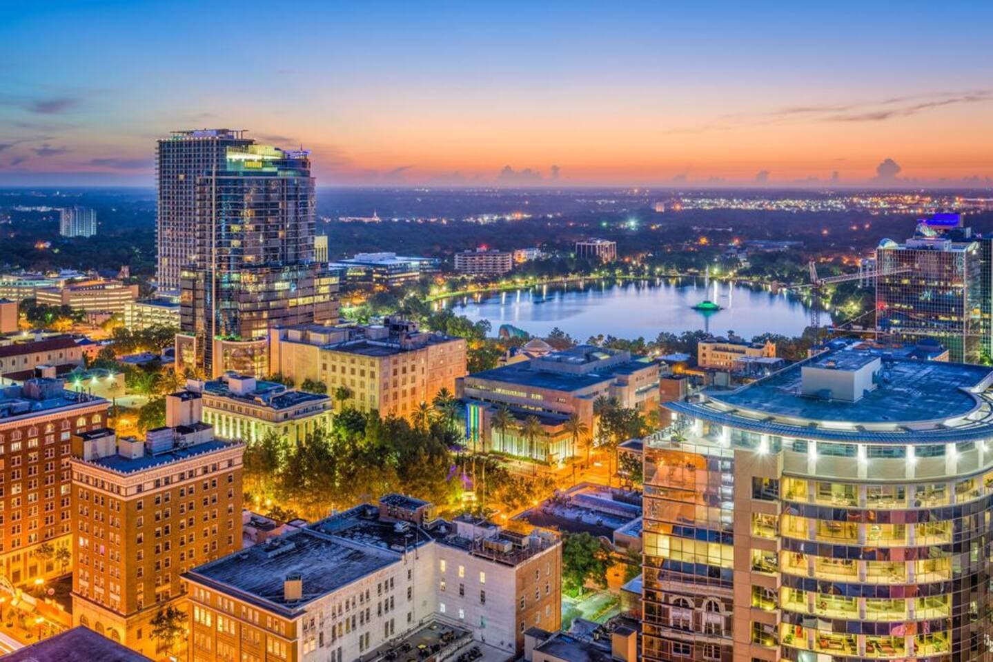 Beautiful sunset aerial view of the Downtown Orlando skyline and local lakes